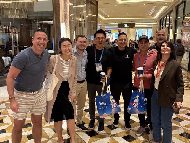 ClinX members posing together at a conference venue